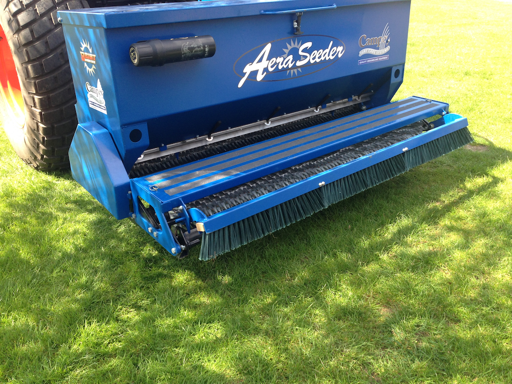 Dimpled roller with seed hopper