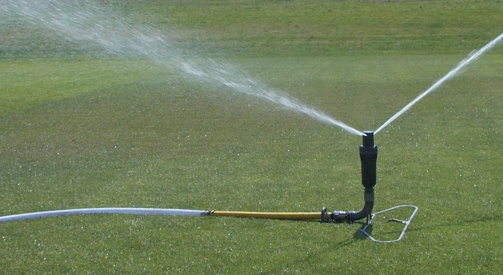 Sprinkler watering a pitch